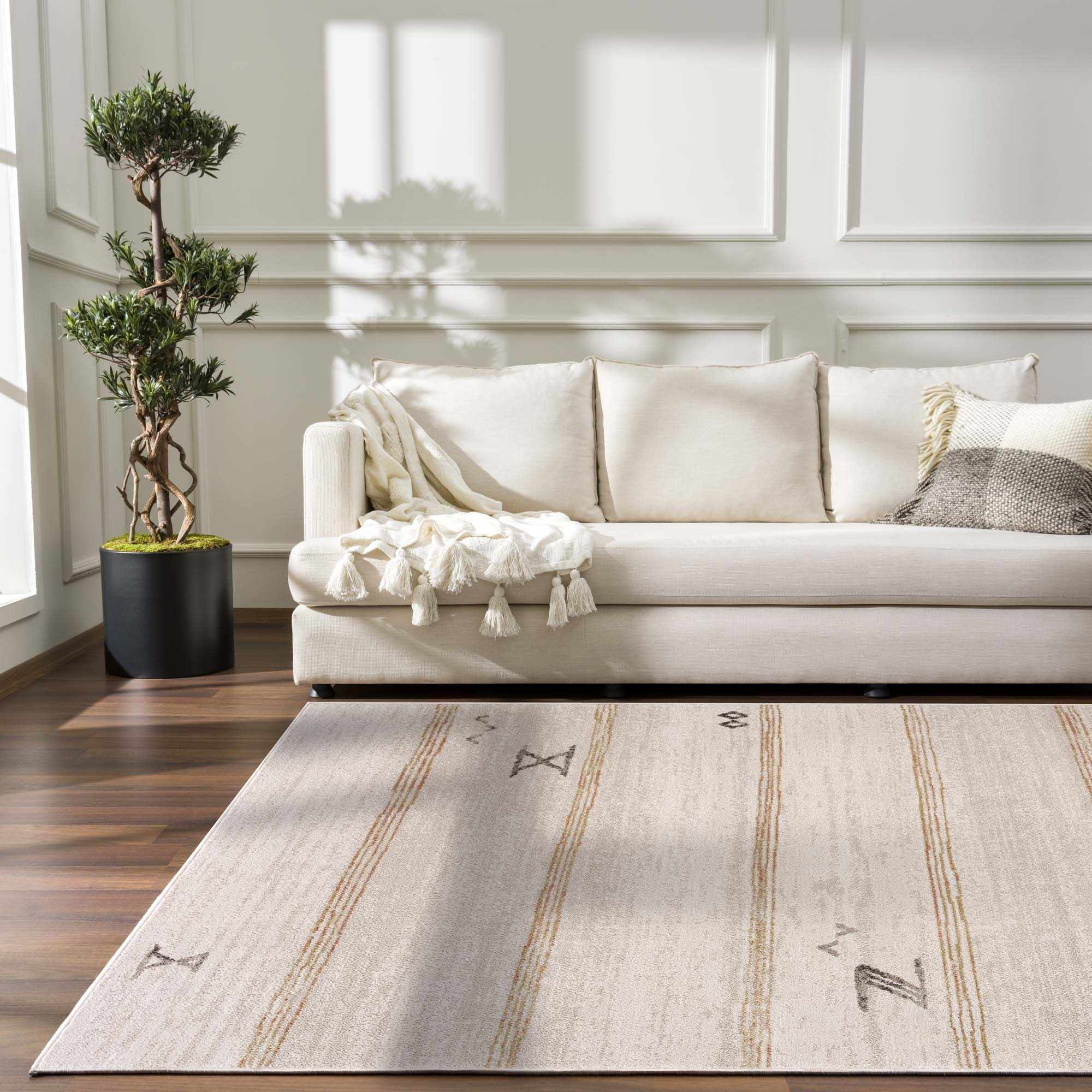 Elegant Hauteloom Deja Cream & Gold Area Rug